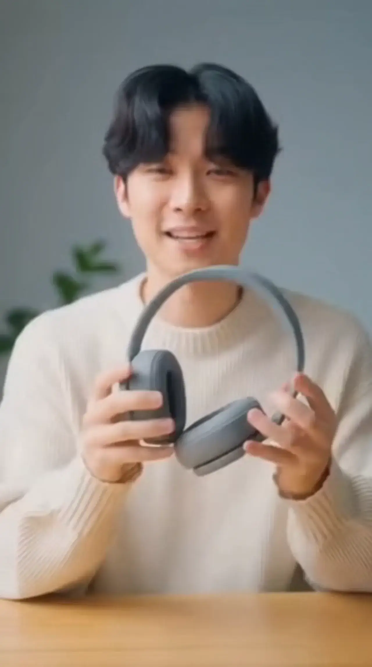 Text to Video example: vertical product teaser of a creator presenting over-ear headphones
