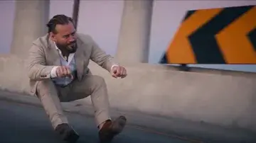 Rider in the reference video: a person low over the road with fists forward