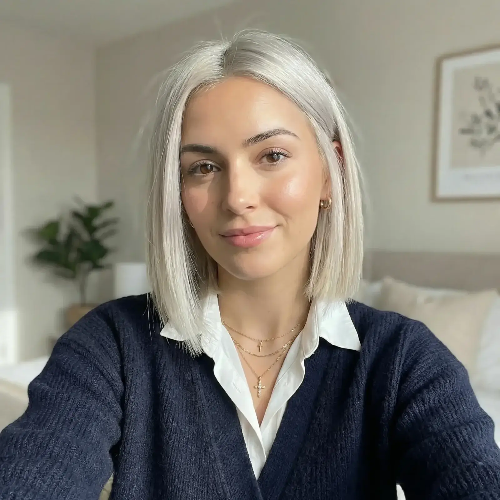 AI Photo Editor example: the same woman after a straight platinum blonde bob