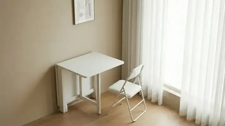 AI Photo Editor example: a folded white desk and chair wiped into the same room set up for use